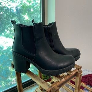 Black zip up heeled boots